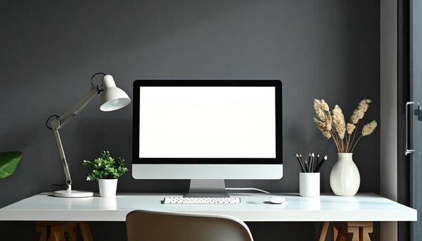 Minimalist Workspace with Computer and Desk Lamp on White Table. photo