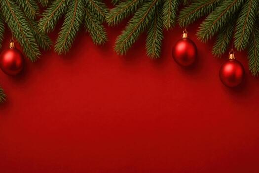 Red Christmas background with decorative fir tree branches and baubles. photo