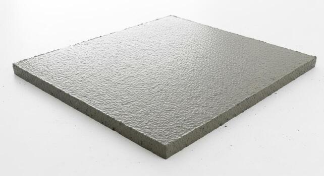 Textured gray paving stone square isolated on white background photo