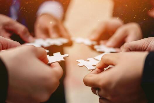 Jigsaw puzzles combine teamwork, unity and teamwork, achieving success in work and business growth photo