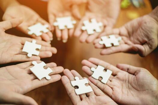 Jigsaw puzzles combine teamwork, unity and teamwork, achieving success in work and business growth. photo
