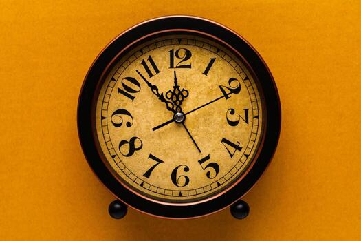Clocks tell the time of work and life, using valuable time and managing time effectively. Photo in studio.