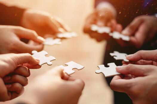 Jigsaw puzzles combine teamwork, unity and teamwork, achieving success in work and business photo