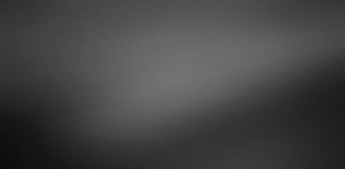 A blurred monochrome image showcasing a gradient of light and dark shades, creating a soft and abstract visual effect.black and gray gradient background vector