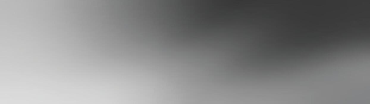 An abstract image featuring soft, blurred shapes and shades of gray, creating a sense of motion and depth.A blurred monochrome image showcasing a gradient of light and dark shades.abstract background vector