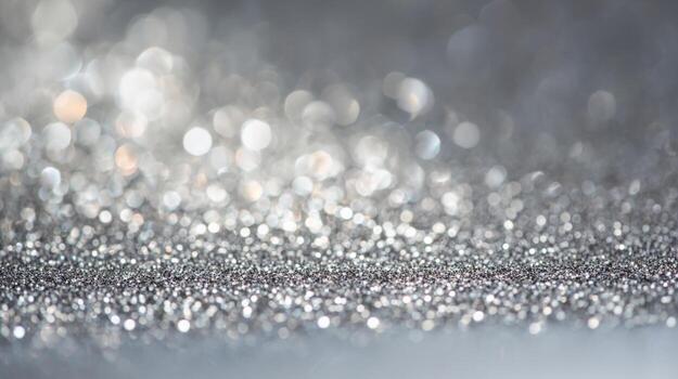 Glittering silver surface shines under soft light creating a magical atmosphere for festive occasions and artistic projects photo