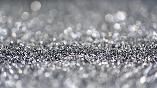 Shimmering silver glitter creates a stunning backdrop with sparkling reflections in soft focus lighting photo