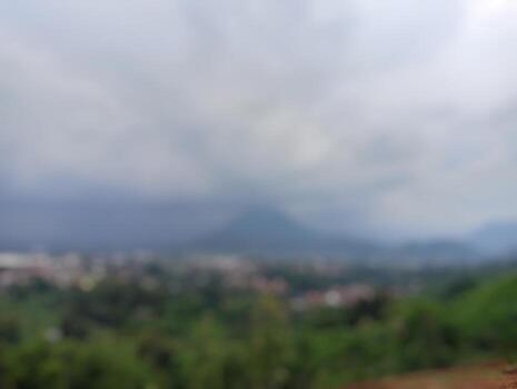 Blurred gray cloudy sky with overcast atmosphere above distant horizon view. photo