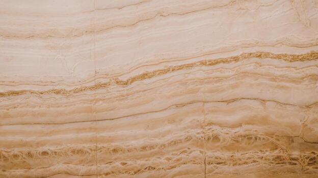 Close up of a Light Brown Patterned Slab of Marble in Natural Lighting photo