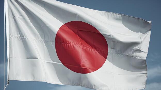 Waving Flag of Japan With White Background and Red Circle in a Cloudy Sky photo