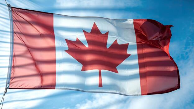 Canadian Flag Waving Gently on a Clear, Partly Cloudy Day in Canada photo