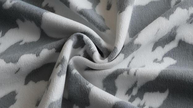 cerca arriba de gris y blanco estampado tela con cubierto suave pliegues creando textura foto