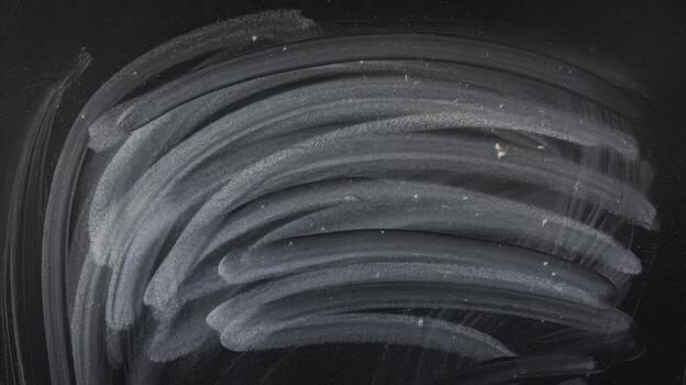 Chalkboard With Eraser Marks Shows Erased Curved Lines on Black Background photo