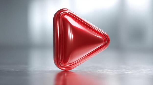 A shiny, red play button icon on a reflective surface, creating a modern and sleek digital atmosphere. photo