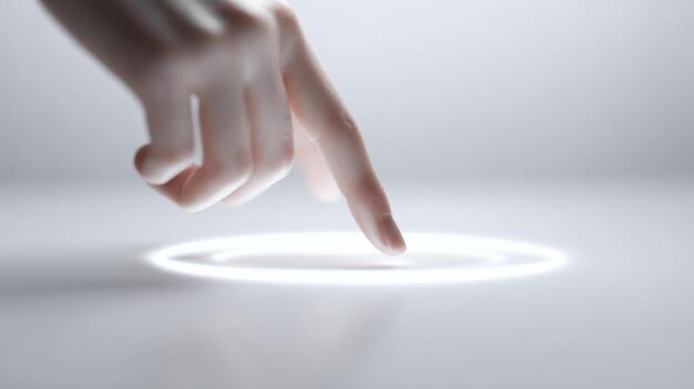 A close-up of a delicate hand interacting with a glowing circular light, suggesting a connection between technology and human touch. photo