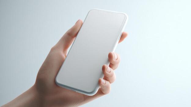 A close-up of a hand holding a sleek, modern smartphone against a light background, showcasing minimalism and technology. photo