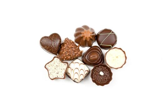 A collection of assorted chocolates with different shapes and sizes photo