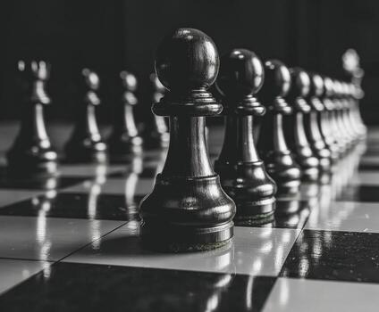 un negro y blanco ajedrez tablero con un negro empeñar en el medio foto