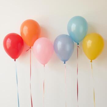 A bunch of balloons in various colors are hanging from a wall photo