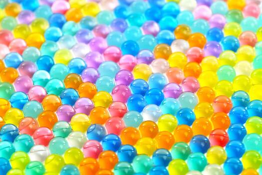 A colorful array of small, clear, and shiny spheres photo