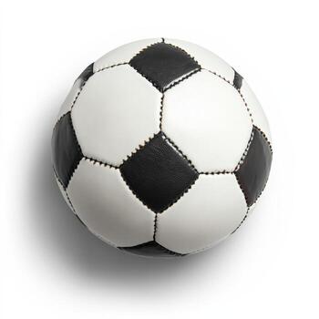 black and white soccer ball is resting on a plain white surface photo
