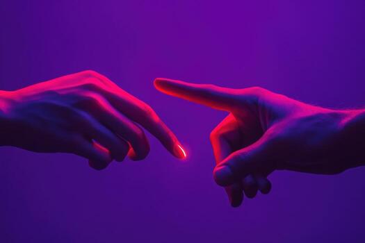 Two hands gently touching each other against a purple background photo
