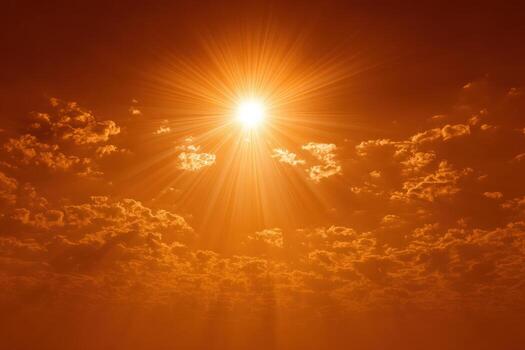 Bright sun radiating warm light through fluffy clouds in a vibrant orange sky, creating a stunning atmospheric effect and evoking feelings of tranquility and warmth photo