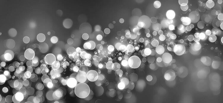 Abstract black and white bokeh background with shimmering light spots creating a dreamy atmosphere, ideal for artistic projects and creative design applications photo