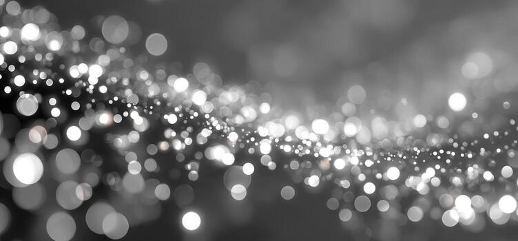 Abstract black and white bokeh background with shimmering light spots creating a dreamy atmosphere, perfect for design projects and artistic presentations photo