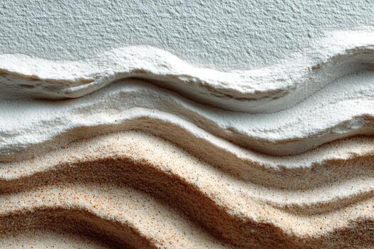 Textured layers of fine white and brown sand create a visually striking abstract composition, showcasing natural patterns and organic shapes in a minimalist style photo