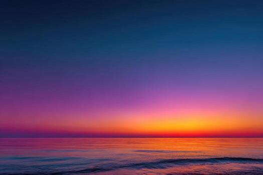 Vibrant sunset over calm ocean waters, showcasing a stunning gradient of colors from deep blue to warm orange and purple, creating a serene and tranquil atmosphere photo