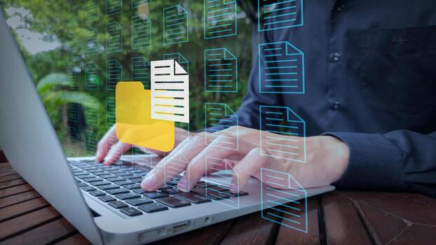 Digital File Management with Laptop and Floating Document Icons in Natural Setting photo