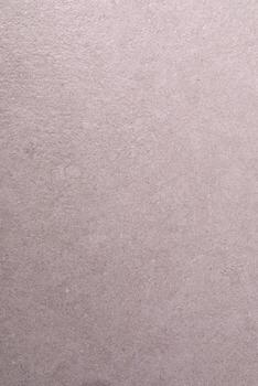 Textured gray surface with subtle variations in tone and pattern creating a minimalistic backdrop photo