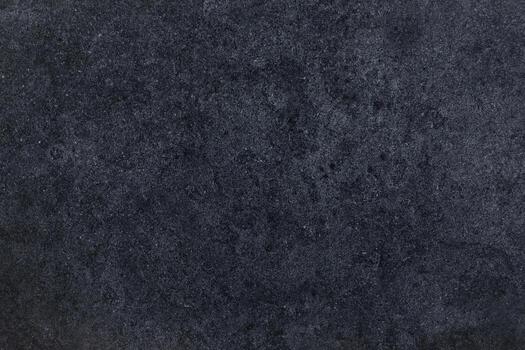 Dark textured surface with a subtle pattern creating a modern and elegant backdrop photo