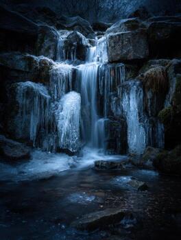 A Frozen Waterfall with Mystical Water Flowing Under It photo