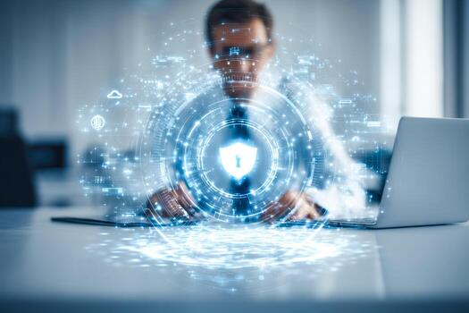Digital cybersecurity concept with a person using a laptop and holographic security lock icon photo