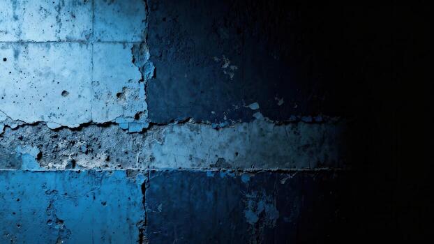 Distressed concrete surface illuminated by dramatic blue light transitions to deep shadow photo