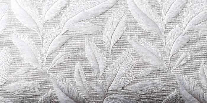A subtle textured off white background features an elegant repeating leaf pattern with a woven fabric appearance photo