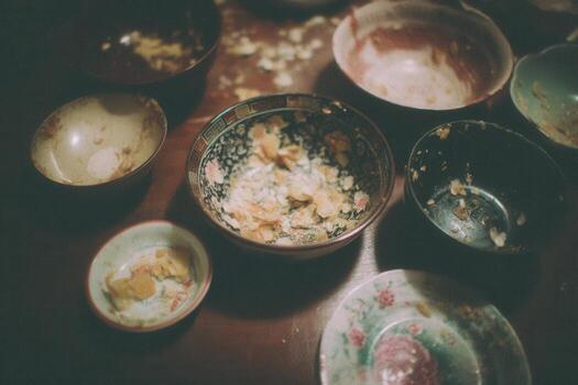 Empty Dipping Bowls and Crumbs After Egg Roll Meal photo