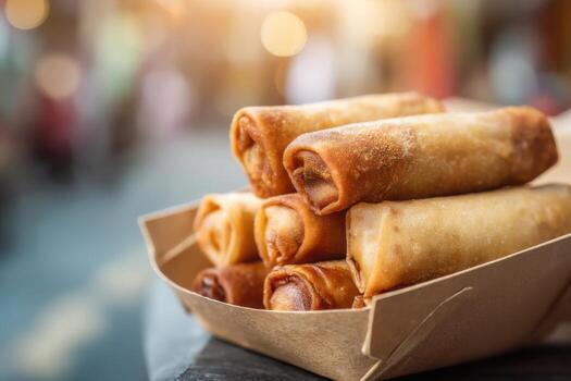 Closeup Egg Rolls Takeout Box with Urban Background photo