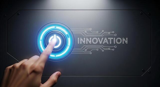 Finger pressing glowing blue power button with INNOVATION text and circuit board design on metal panel for technology and startup concepts photo