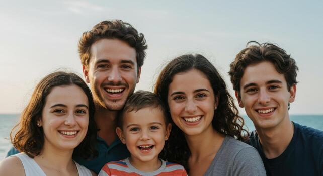 A family posing for a photo on the beach