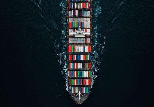 An aerial view of a container ship with many containers on it photo