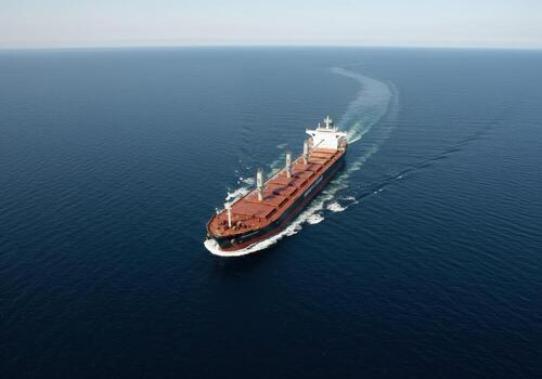 An aerial view of a large cargo ship in the ocean photo