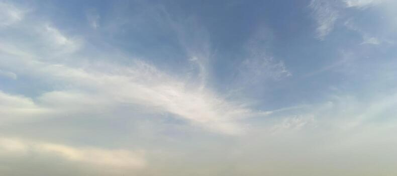 Dreamy sky with soft clouds and ethereal light creating a peaceful and calming atmosphere for meditation and relaxation photo