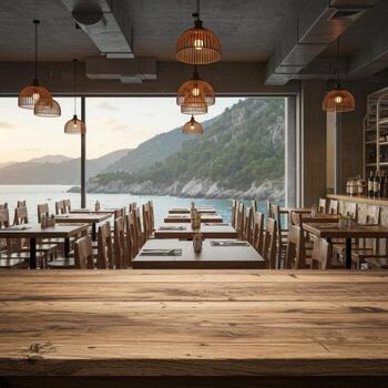 A restaurant with tables and chairs in front of a large window photo