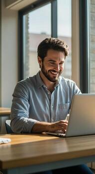 Confident smiling businessman actively working on laptop in bright modern office space, enjoying productive workday success photo