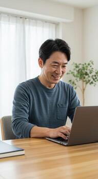 Smiling middle aged man joyfully typing on laptop at home office desk, embracing modern remote work lifestyle with enthusiasm and productivity. photo