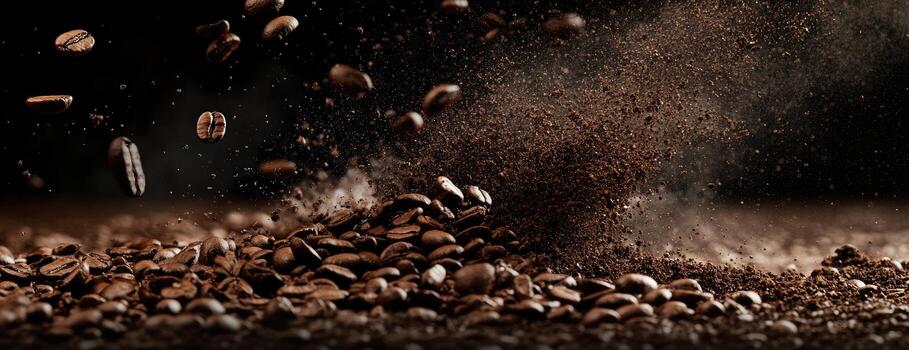 Coffee beans exploding in a dark background photo
