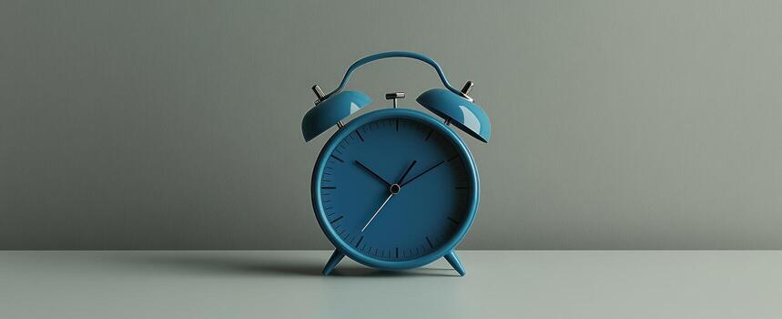 Blue alarm clock against a neutral background photo